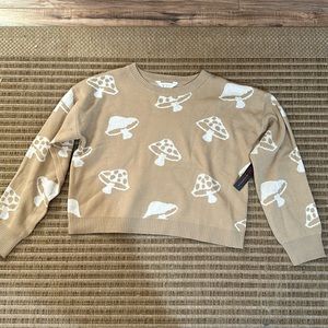 I am selling a kid sweatshirt size large and it is a mushroom sweatshirt